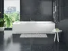 A modern bathroom with a white rectangular bathtub, dark tiled walls, and a large window overlooking a city. Produktbild-Vorschau