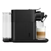 Side view of a black Nespresso coffee machine with a water tank on the left and a glass of latte macchiato on the right. Produktbild-Vorschau