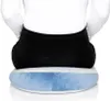 A person sitting on a blue and white cushion. Produktbild-Vorschau
