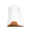 A front view of a white Skechers sneaker with a brown sole. Anteprima dell’immagine prodotto