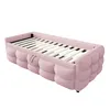 A pink upholstered daybed frame with a slatted base, shown from a side angle against a white background. Podgląd zdjęcia produktu