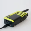 A close-up shot of a Kenwood UBZ-LJ9SET PMR-Funkgerät 2er Set, with a USB cable plugged into its charging port. Náhled obrázku produktu