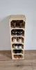 A tall, narrow wooden shoe rack made of stacked crates, filled with various shoes. Produktbild-Vorschau