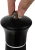 A hand is shown adjusting the top of a black pepper mill. Produktbild-Vorschau