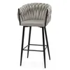 A light gray bar stool with a braided backrest and black legs is shown against a white background. Produktbild-Vorschau