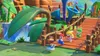 Mario and Rabbids characters walk across a wooden bridge in a colorful, cartoonish environment. Produktbild-Vorschau