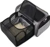 A portable pet carrier with mesh panels and a compartment filled with cat litter. Náhled obrázku produktu
