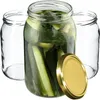 Three glass jars, one filled with pickles and brine, and a gold lid. Anteprima dell’immagine prodotto