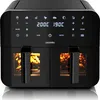 A black dual-chamber air fryer with food visible inside the chambers. Produktbild-Vorschau