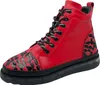 A single red boot with black accents and laces is shown against a white background. Produktbild-Vorschau