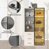 A white display cabinet with glass doors and LED lighting, showcasing kitchenware and decorative items. Close-up insets highlight product features. Náhľad obrázku produktu
