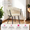 A beige upholstered armchair with black legs is shown in a well-lit room, with plants and furniture in the background. The bottom of the image has a pink overlay with text and icons highlighting product features. Náhled obrázku produktu