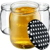 Three glass jars, one filled with a golden liquid, and a black polka dot lid are arranged on a white background. Voir les images du produit
