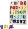 A wooden alphabet puzzle board with colorful wooden letters. Some letters are also shown outside the board. Voir les images du produit
