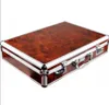 A closed briefcase with a wood-grain pattern and silver trim. Anteprima dell’immagine prodotto