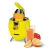 A yellow electric citrus juicer with oranges and grapefruits, next to a glass of juice. Podgląd zdjęcia produktu