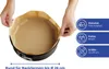 Hands lining a round baking pan with parchment paper. Anteprima dell’immagine prodotto