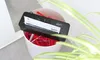 A paper shredder is placed on top of a trash can, shredding an invoice. Green leaves are in the foreground. Anteprima dell’immagine prodotto