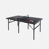 A black ping pong table with two paddles and three balls, set against a white background. Produktbild-Vorschau