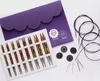A set of knitting needles and accessories laid out on a white background. Produktbild-Vorschau