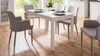 A dining room scene with a white table and chairs. Produktbild-Vorschau