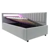 A light gray upholstered bed frame with its storage compartment open, revealing the slatted base and LED lighting. Náhled obrázku produktu