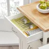 A drawer of a kitchen cart is open, showing cutlery and a napkin. Produktbild-Vorschau