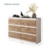 A dresser with six drawers, decorated with a bird figurine, books, and dried flowers. Voir les images du produit