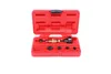 A red plastic case containing a set of tools, including a brass-colored tool with black attachments. Náhľad obrázku produktu