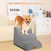 A Corgi dog stands on a gray pet staircase in a living room setting. Produktbild-Vorschau