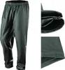 A pair of dark gray rain pants shown from the front, with close-up views of the waistband and ankle closure. Produktbild-Vorschau