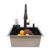 A kitchen sink with a faucet, soap dispenser, and a glass rinser, filled with fruit. Náhled obrázku produktu