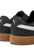 Close-up view of the back of two black Puma sneakers with white accents and brown soles. Produktbild-Vorschau