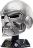A detailed, close-up view of a silver helmet, likely a collectible or prop, displayed on a black stand with intricate detailing. Anteprima dell’immagine prodotto