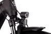 A close-up view of the front of a black e-bike, focusing on the headlight and front fender. Produktbild-Vorschau