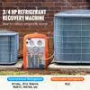 A refrigerant recovery machine positioned between two air conditioning units against a brick wall. Podgląd zdjęcia produktu