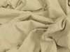 A close-up view of crumpled beige fabric, likely a bedsheet. Produktbild-Vorschau