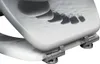 A close-up view of a toilet seat with a decorative pattern. Produktbild-Vorschau