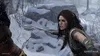 A woman in a snowy environment holding a weapon, looking intensely. Náhľad obrázku produktu