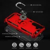 An exploded view of a red and black phone case with silver accessories, illustrating its components and features. Produktbild-Vorschau
