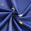 A close-up view of a blue fabric with a star pattern, folded and creased. Produktbild-Vorschau