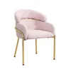 A pink upholstered chair with gold metal legs, presented against a white background. Produktbild-Vorschau