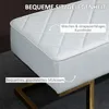 A close-up of a white tufted bench with a gold metal base, featuring text overlays describing its features. Náhľad obrázku produktu
