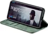 A smartphone in a green flip case, displaying a movie poster on its screen. Produktbild-Vorschau