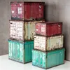 A stack of storage containers resembling industrial shipping containers. Produktbild-Vorschau