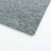 A close-up view of a gray carpet tile. Produktbild-Vorschau