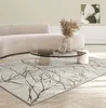 A modern living room scene with a sofa, coffee table, and a rug. Náhled obrázku produktu