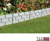 A garden border made of gray stone-like blocks separates a lawn from a flower bed. Produktbild-Vorschau