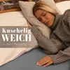 A woman sleeping comfortably in bed, with text overlay promoting the product. Produktbild-Vorschau