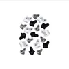 A collection of climbing holds in various shapes and sizes, predominantly black and white with some gray. Voir les images du produit